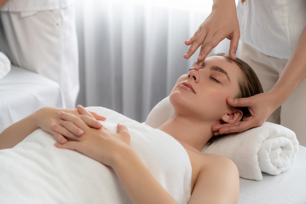 Caucasian woman enjoying relaxing antistress head massage quiescent