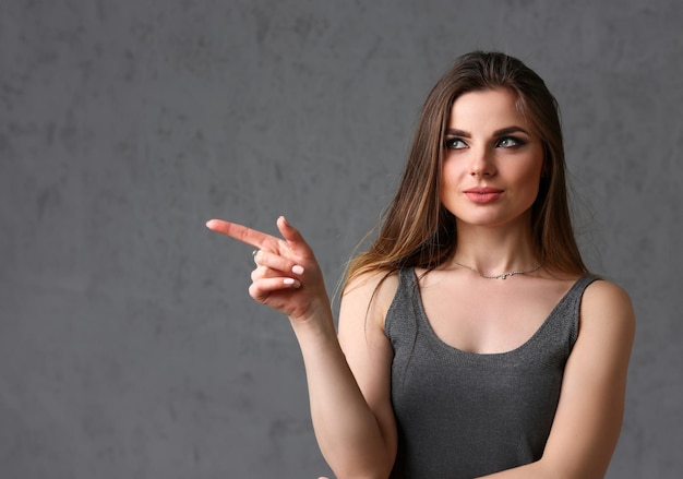 A caucasian woman on a gray background