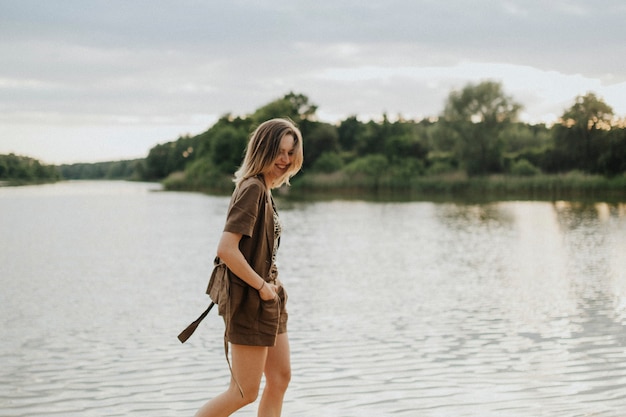 Caucasian woman is relaxing by the water