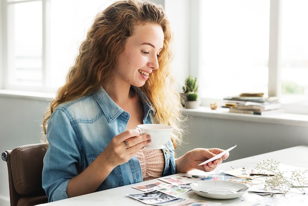 Caucasian woman looking at photos