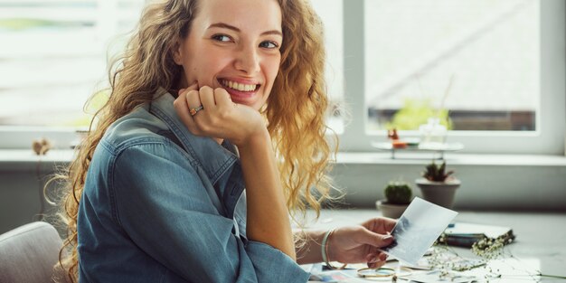 Caucasian woman looking at photos