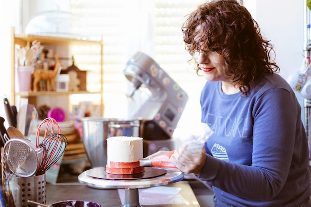 Caucasian woman preparing a cake. Baking at home. Selective focus.