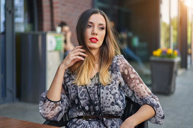 Caucasian woman sitting outdoor cafe