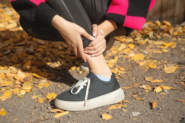 Caucasian woman suffering from pain in feet