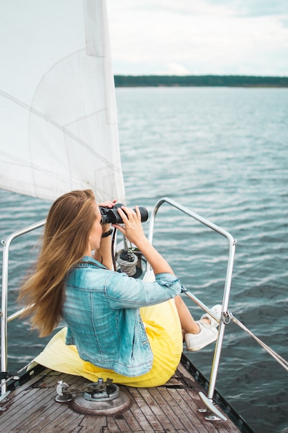 Caucasian Woman Watching Binocular on the Sailboat