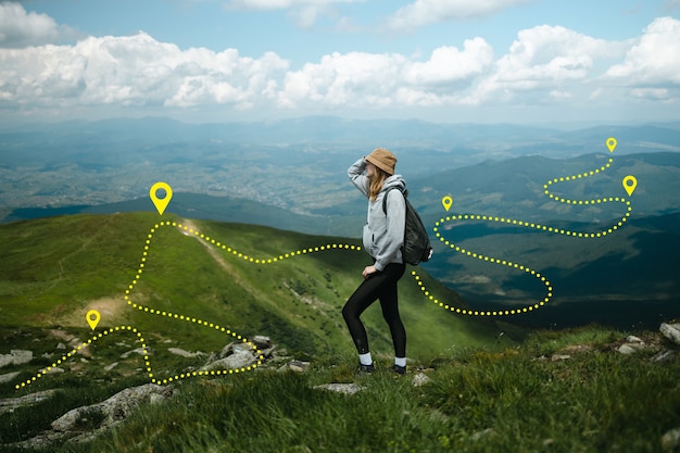 Caucasian woman wearing traveler backpack traveling alone on outdoors among of mountains success and...