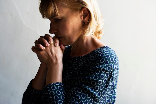 Caucasian woman with interlocked fingers