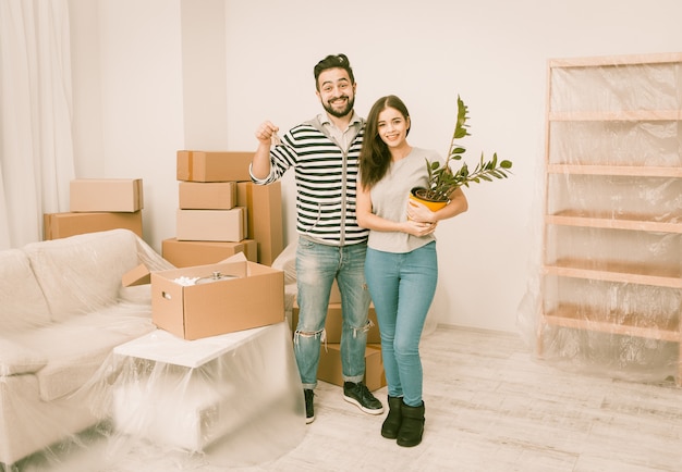 Caucasian young couple happy to moving in to new apartment.