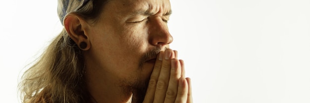 Caucasian young man's close up shot on studio background, flyer