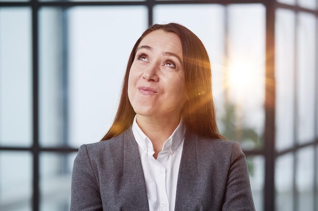 Caucasian young woman looking away in the office