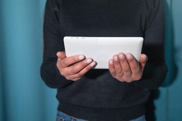 Caucasian young woman using tablet