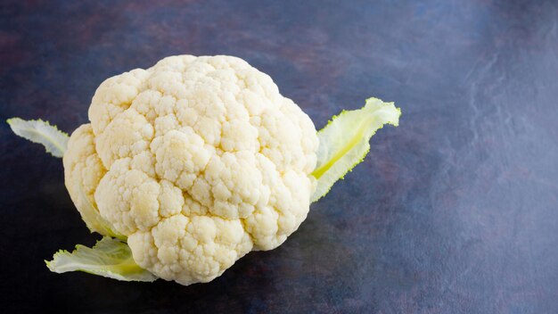 cauliflower on dark background organic cauliflower on dark background vegan healthy food copy space