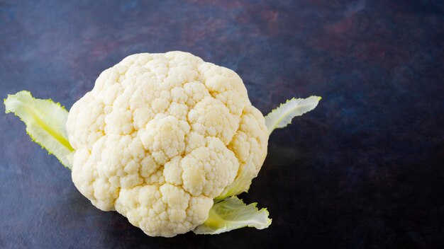 cauliflower on dark background organic cauliflower on dark background vegan healthy food copy space