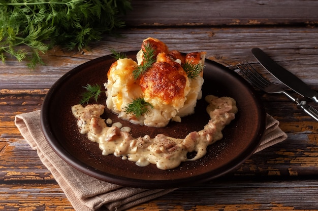 Cauliflower gratin with carbonara sauce on plate