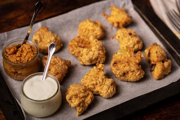 Cauliflower wings food Pieces of cauliflower cooked in batter Meat substitute vegetarian food