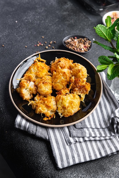 cauliflower with cheese baked vegetables healthy meal food snack on the table copy space food