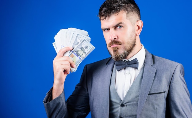 Cause money is work bearded man holding cash money business
startup loan rich businessman with us dollars banknotes currency
broker with bundle of money making money with his own business