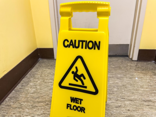 caution sign stands tall against a backdrop of hard hats and heavy machinery symbolizing safety aw