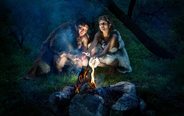 Cave people near bonfire