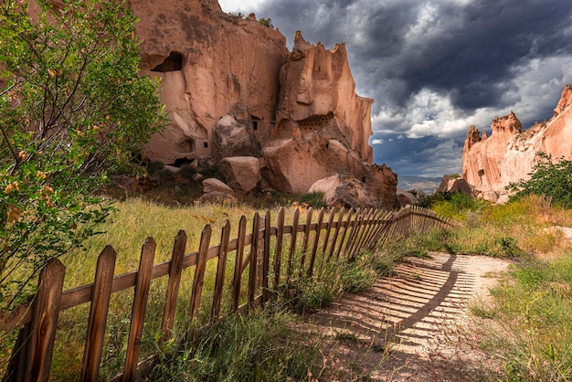 Cave and rock formations wooden fence in the zelve valley cappadocia