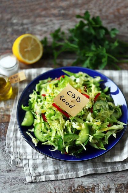 CBD salad with fresh cabbage, herbs and cucumber.