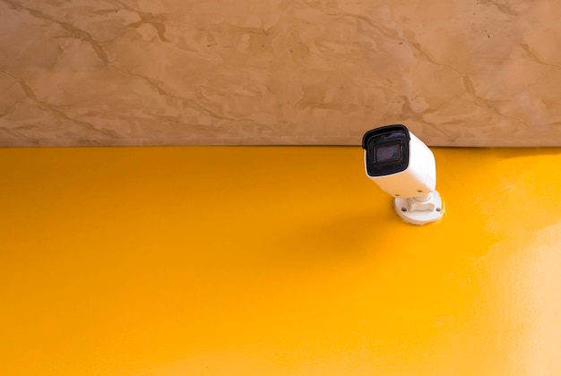 Photo cctv camera system on orange background