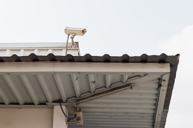 CCTV surveillance camera on the roof in sanny day