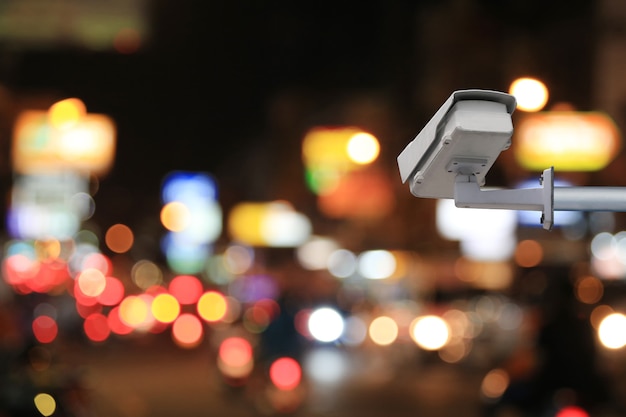 CCTV system on blur road at night background and have copy space for design in your work.