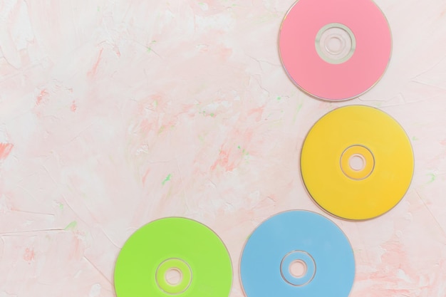 CD or DVD discs on pink background