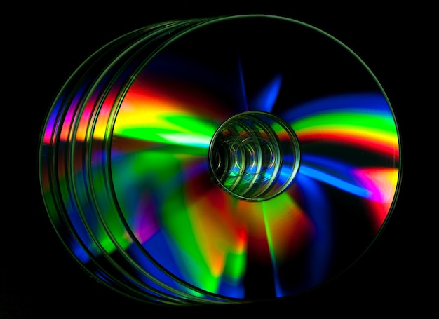 CD and DVD disk on black background