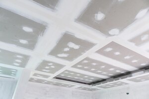 Ceiling gypsum board installation at construction site