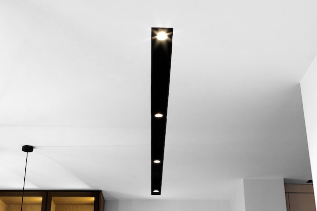 Ceiling led lamp in the interior magnetic track stylish and\
modern loft style lamp in the apartment