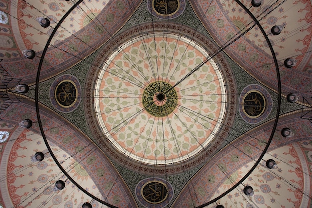 The ceiling of a mosque with the words " ramadan " on it.