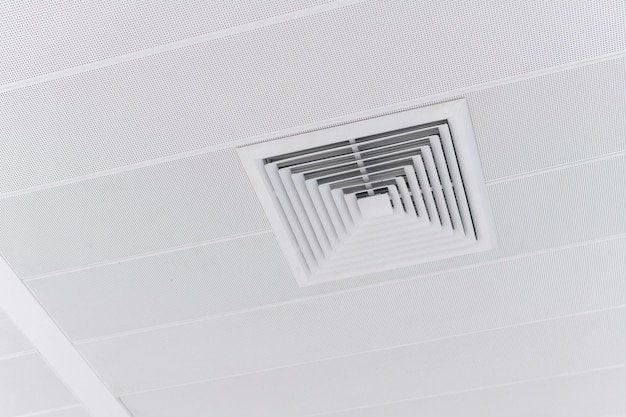 Ceiling mounted cassette type air conditioner and modern lamp light on white ceiling duct air conditioner for home or office