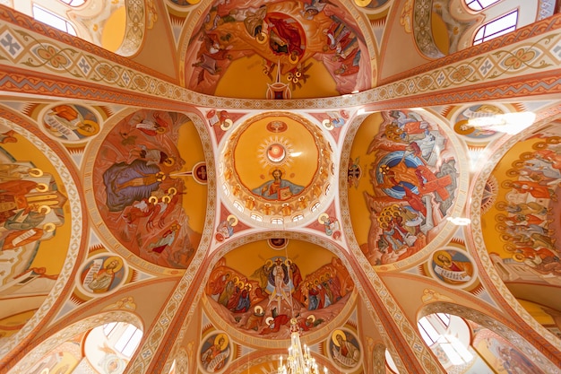 Photo ceiling of the orthodox church with drawings of saints. ceiling of the orthodox church.