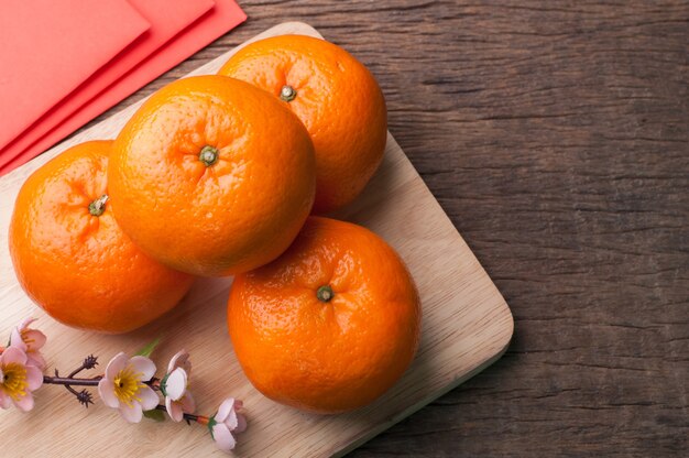 celebrate Chinese New Year background with orange fruit.