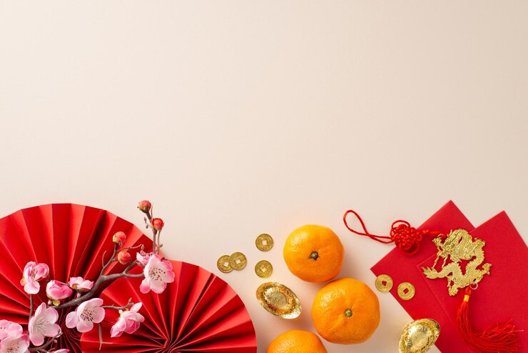 Photo celebrate chinese new year with flair using this captivating arrangement top view of fans feng shui treasures coins decorative elements on neutral background leaving space for celebratory message