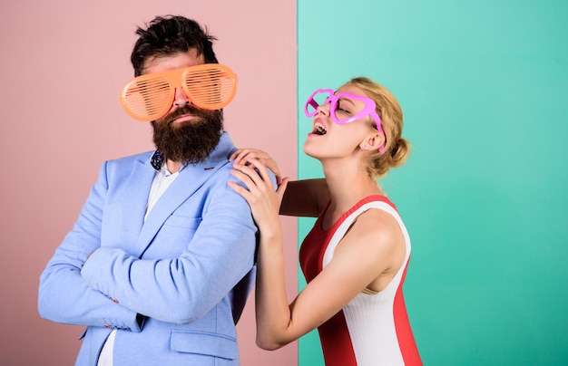 Celebrating holiday party fun couple in love Office party Best friends relations hipster guy and girl party glasses friendship lets celebrate together bearded man with pretty woman