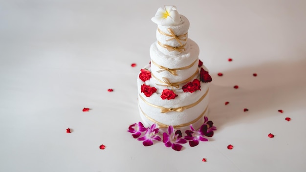 Celebrating surprise in bed with towel cake