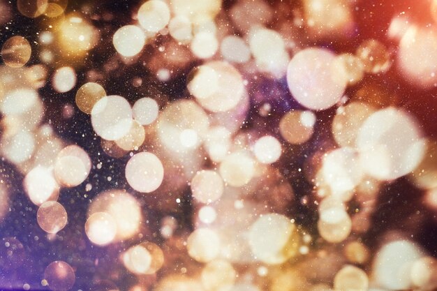 Celebration background with defocused golden lights for Christmas, New Year, Holiday, party