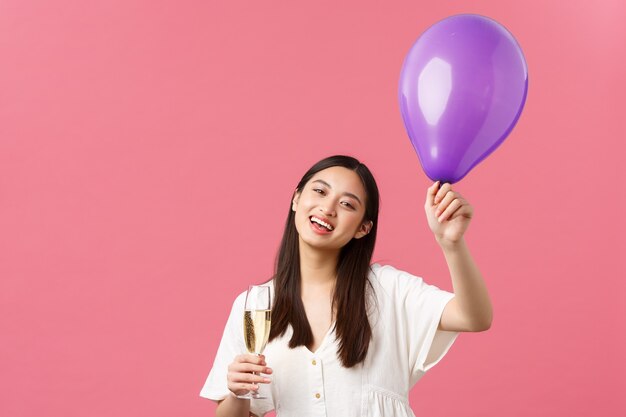 Celebration party holidays and fun concept tender pretty asian woman in white dress holding balloon ...