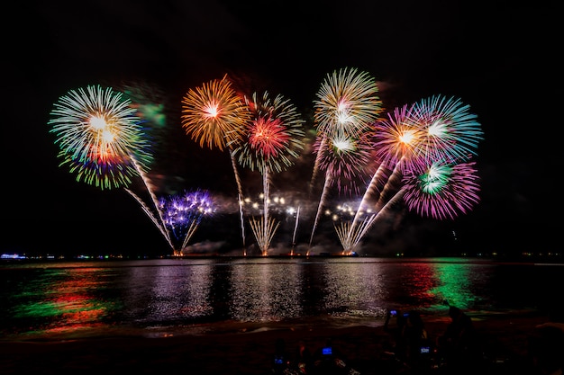 Celebrations firework at night on the sea pattaya city Thailand 