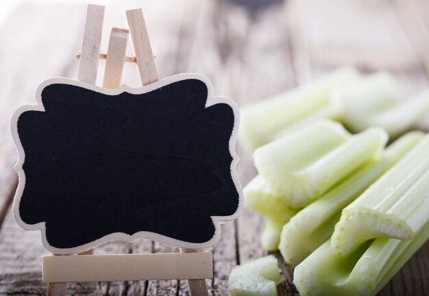 Photo celery,chopped on a wooden board.copy space