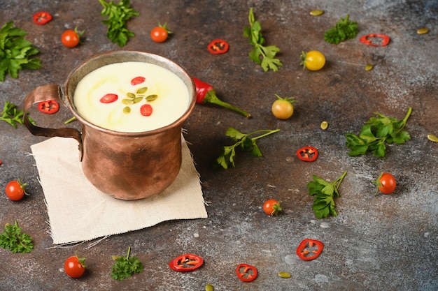 Celery root soup in copper cup