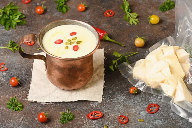 Celery root soup in copper cup