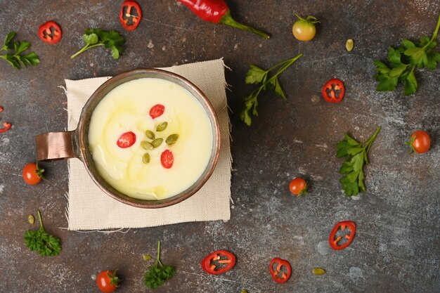 Celery root soup in copper cup