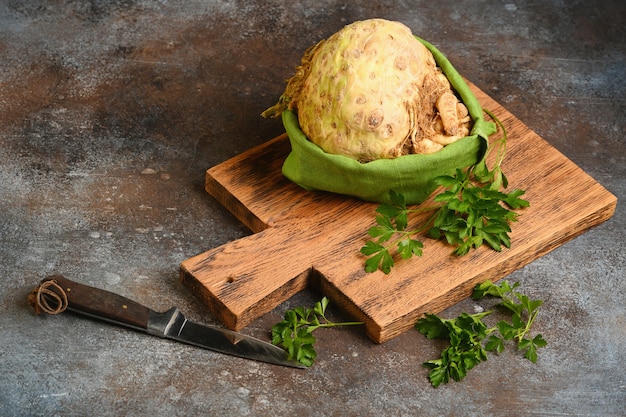 Celery root on wooden cutting board