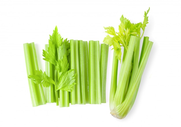 Celery sticks on white wall.