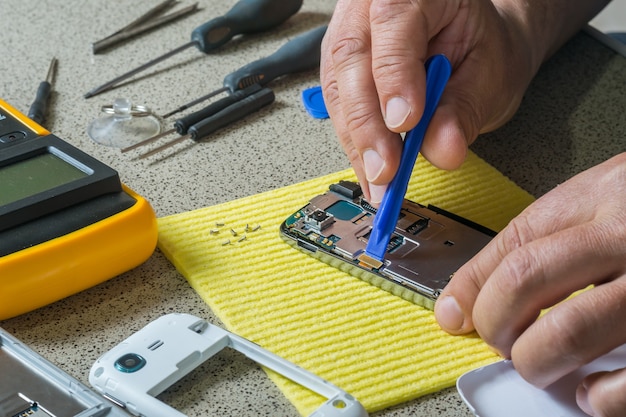 cell phone test and repair. smartphone parts and tools for recovery, selective focus
