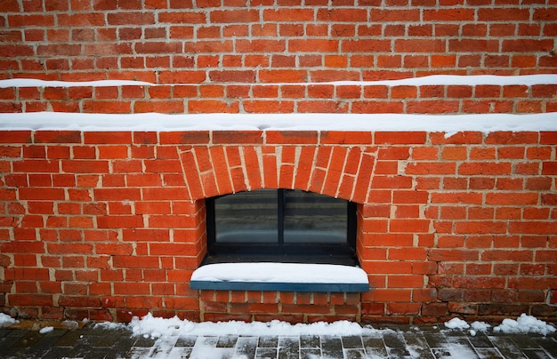 Photo cellar window in brick wall architecture